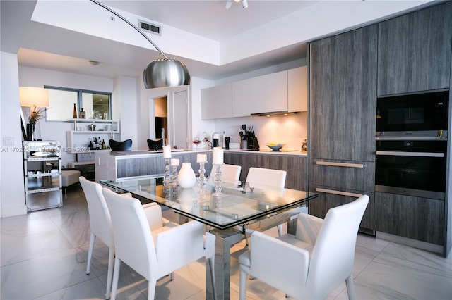 dining room featuring light tile patterned flooring