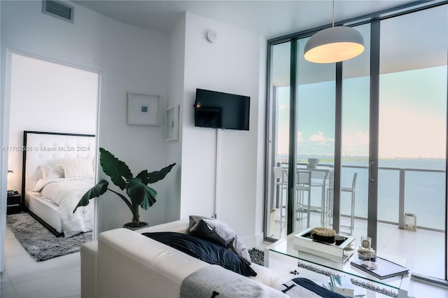 bedroom featuring a wall of windows