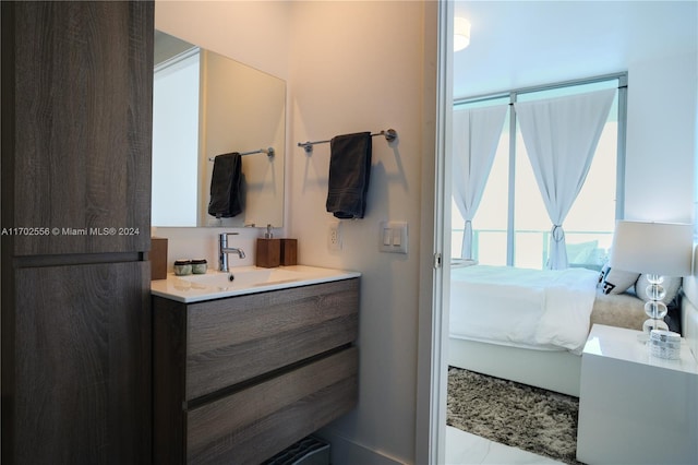 bathroom with tile patterned floors and vanity