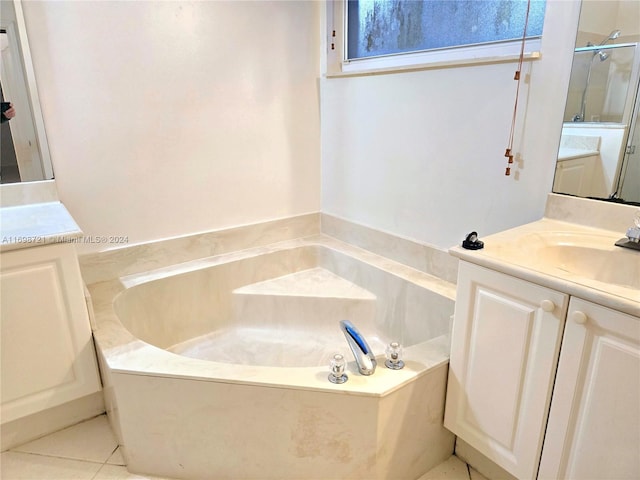 bathroom featuring tile patterned floors, vanity, and separate shower and tub