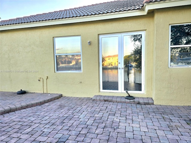 doorway to property featuring a patio