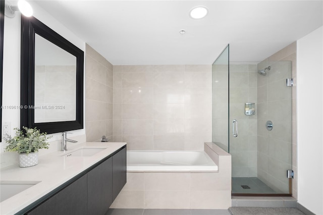 bathroom with separate shower and tub, tile patterned flooring, and vanity