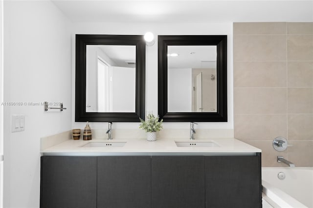 bathroom with vanity and tiled shower / bath combo