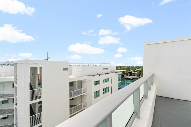 balcony featuring a water view