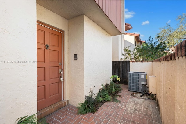 doorway to property featuring central AC