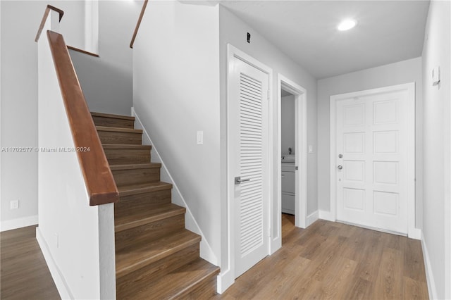 stairs with hardwood / wood-style flooring