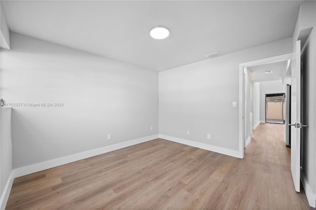 spare room featuring light wood-type flooring