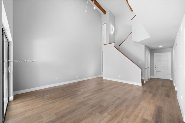 unfurnished living room with hardwood / wood-style floors