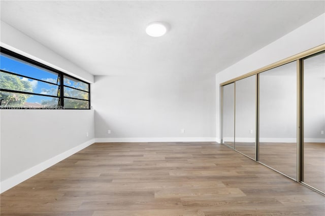 unfurnished bedroom with light hardwood / wood-style floors