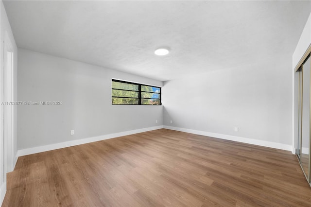 unfurnished room featuring hardwood / wood-style floors