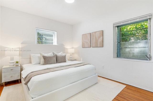 bedroom with hardwood / wood-style flooring