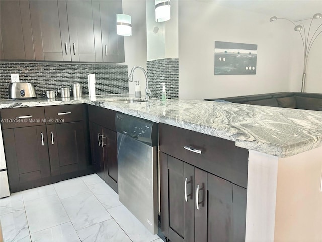 kitchen featuring hanging light fixtures, stainless steel dishwasher, decorative backsplash, light stone countertops, and kitchen peninsula