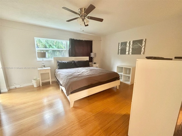 bedroom featuring light wood-type flooring and ceiling fan