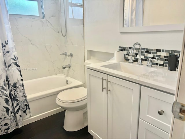 full bathroom with vanity, toilet, shower / bathtub combination with curtain, tasteful backsplash, and wood-type flooring