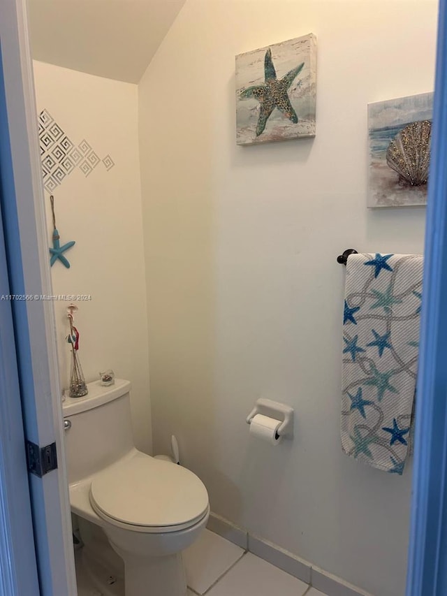 bathroom with tile patterned flooring and toilet