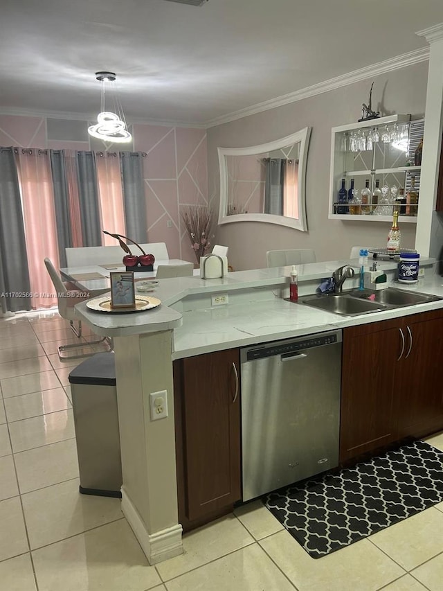 kitchen with stainless steel dishwasher, pendant lighting, dark brown cabinetry, and sink