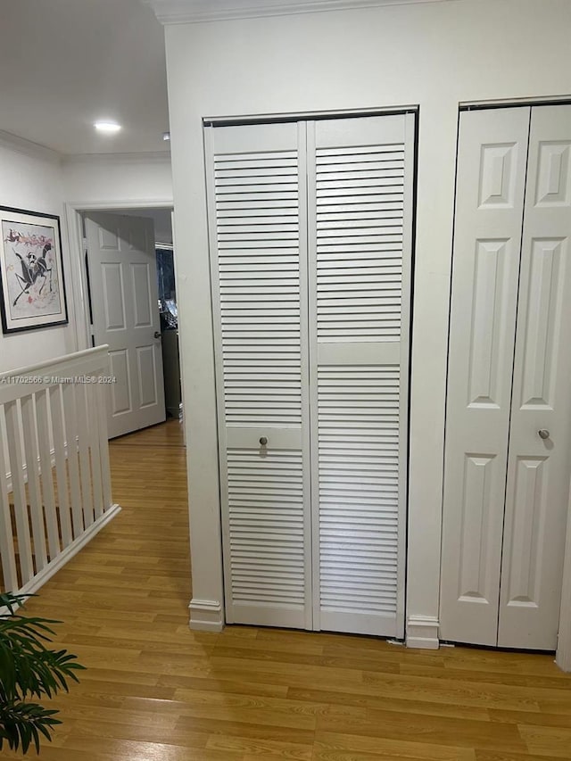 interior details featuring hardwood / wood-style flooring and ornamental molding