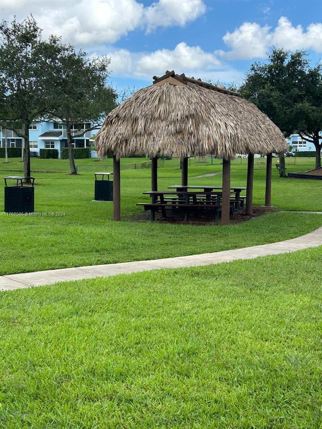 surrounding community featuring a gazebo and a lawn