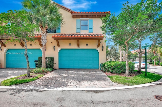 mediterranean / spanish house with a garage