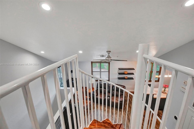 stairway with ceiling fan