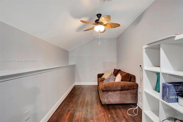 living area with lofted ceiling, ceiling fan, and dark hardwood / wood-style floors