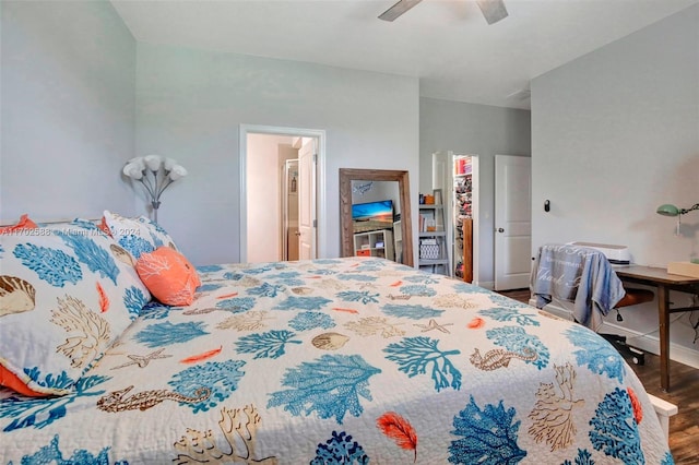 bedroom featuring ceiling fan, ensuite bathroom, and hardwood / wood-style flooring