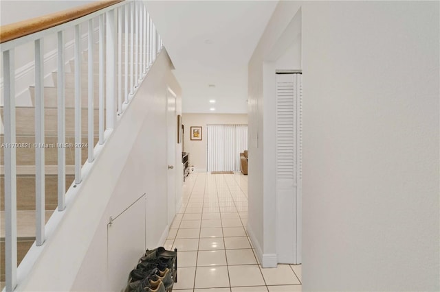 hallway with light tile patterned flooring