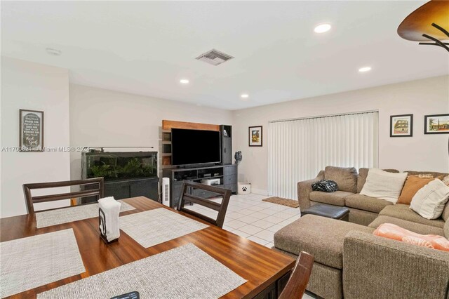 living room featuring ceiling fan and light wood-type flooring