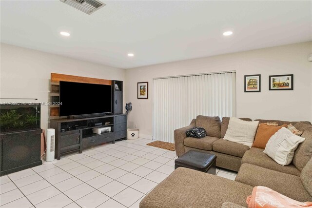 living room with light tile patterned floors