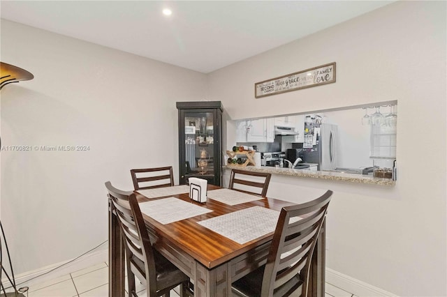 dining room featuring light tile patterned floors