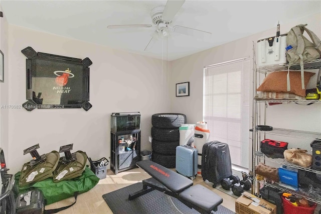 interior space with ceiling fan