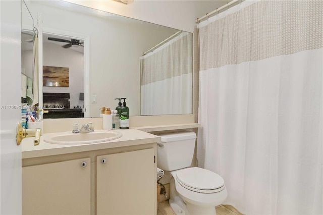 bathroom featuring ceiling fan, vanity, and toilet