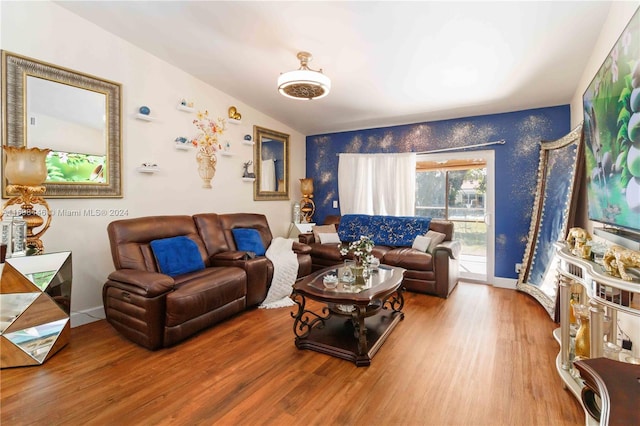 living room with lofted ceiling and wood-type flooring