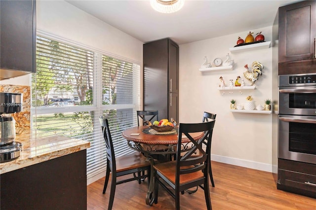 dining area with light hardwood / wood-style floors