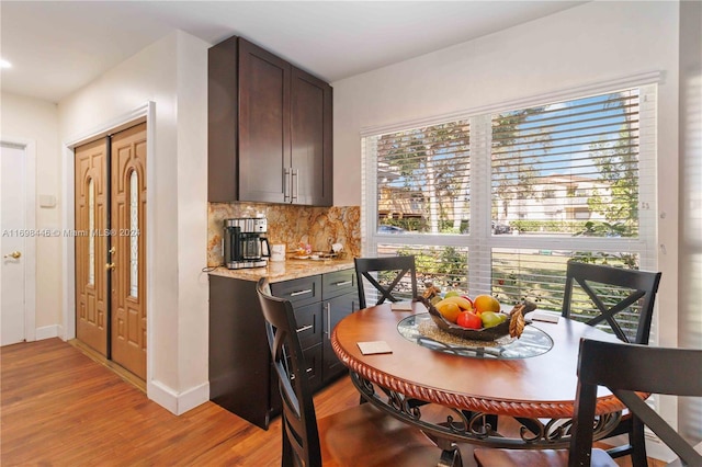 dining area with light hardwood / wood-style floors