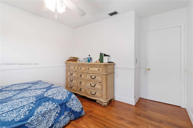 bedroom featuring hardwood / wood-style flooring and ceiling fan