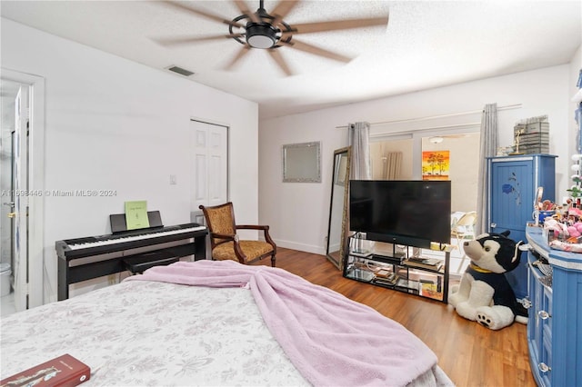 bedroom featuring ceiling fan and hardwood / wood-style flooring