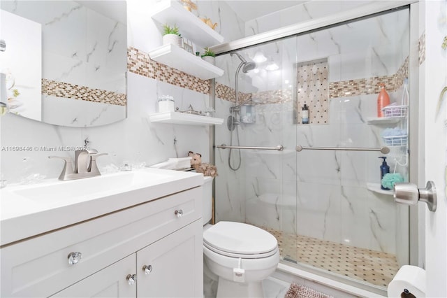 bathroom featuring toilet, vanity, and walk in shower