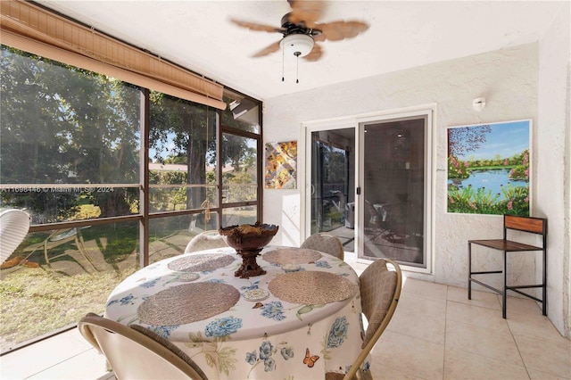 sunroom / solarium featuring ceiling fan