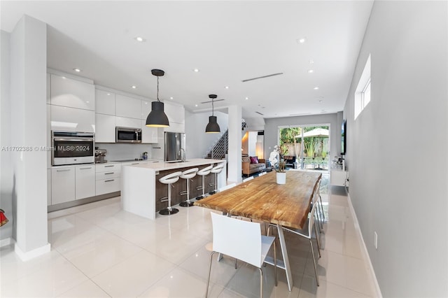 dining space with light tile patterned flooring