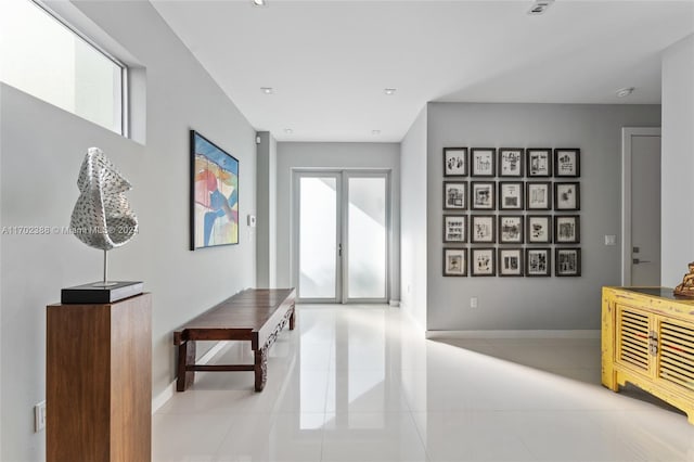 corridor featuring light tile patterned flooring