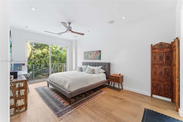 bedroom featuring access to outside, light hardwood / wood-style flooring, and ceiling fan