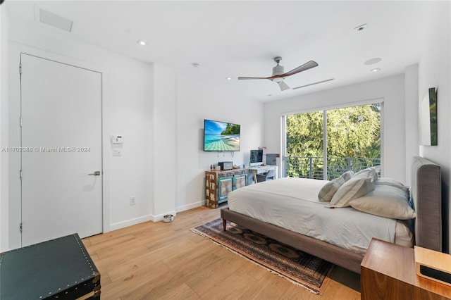 bedroom featuring light hardwood / wood-style flooring and ceiling fan