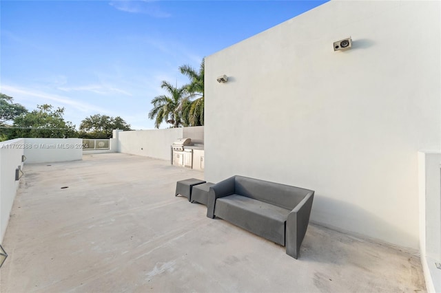 view of patio / terrace featuring an outdoor kitchen and a grill