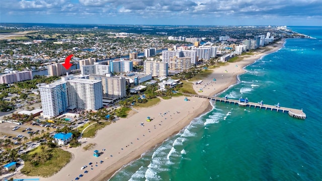 birds eye view of property featuring a view of the beach and a water view