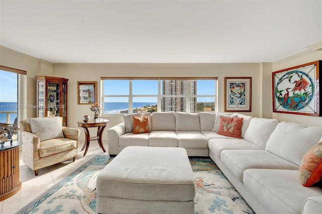 tiled living room featuring a water view, a wealth of natural light, and ornamental molding