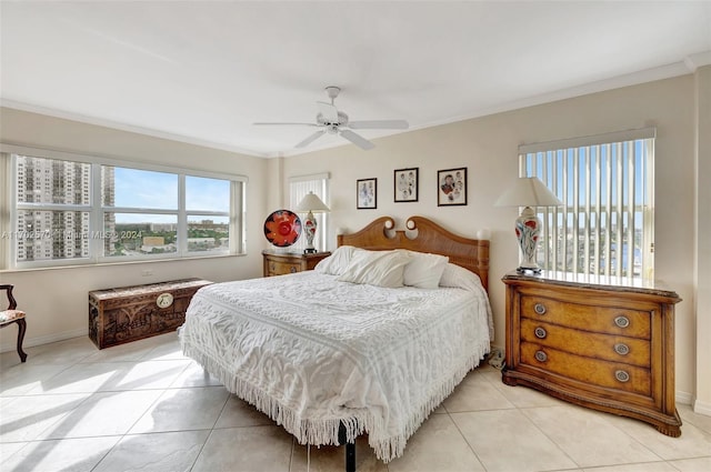 bedroom with ceiling fan, light tile patterned floors, and ornamental molding