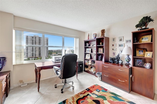 office space featuring light tile patterned floors and a textured ceiling