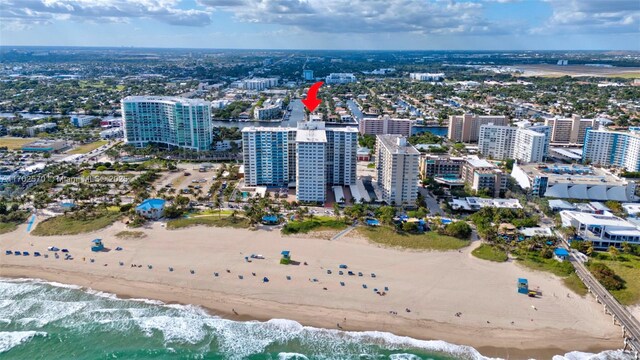 aerial view with a beach view and a water view