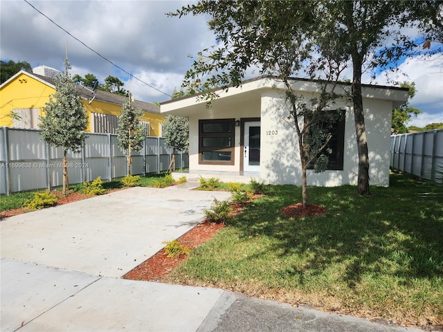 bungalow with a front lawn